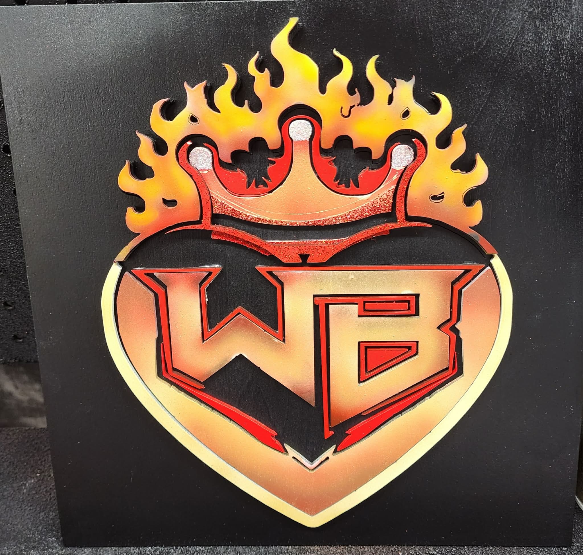 WorkBench Creations flame-heart logo, laser cut and painted